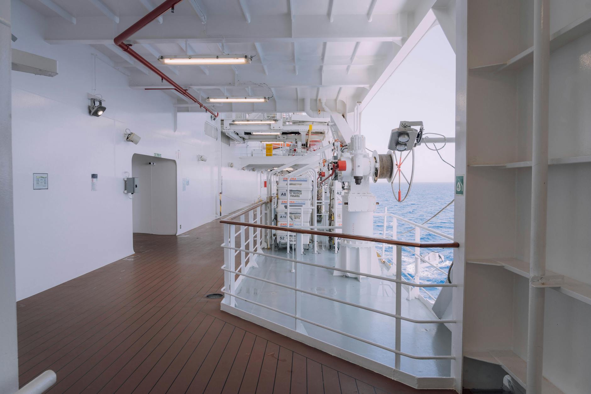 Modern cruise ship deck with ocean view and relaxation areas