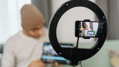 Travel content creator filming video with smartphone while exploring destination