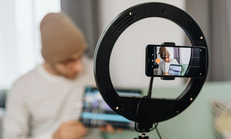 Travel content creator filming video with smartphone while exploring destination