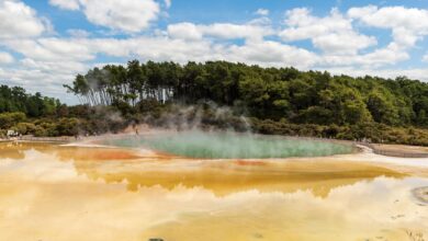 Natural thermal pool surrounded by volcanic landscape in the Azores
