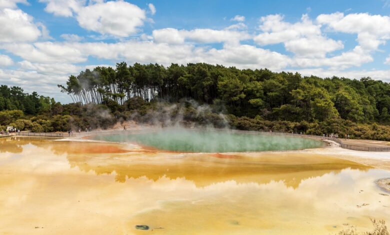 Natural thermal pool surrounded by volcanic landscape in the Azores