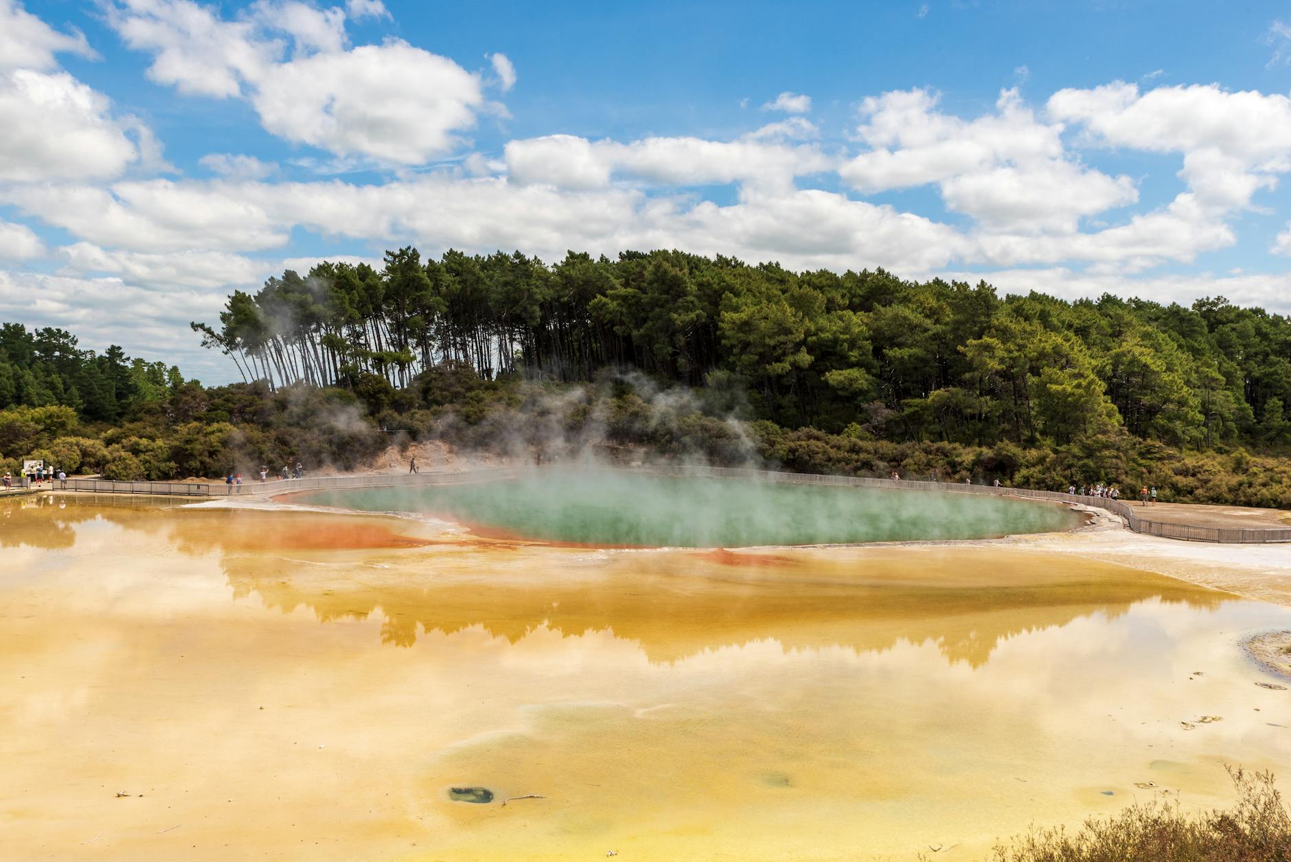 Natural thermal pool surrounded by volcanic landscape in the Azores