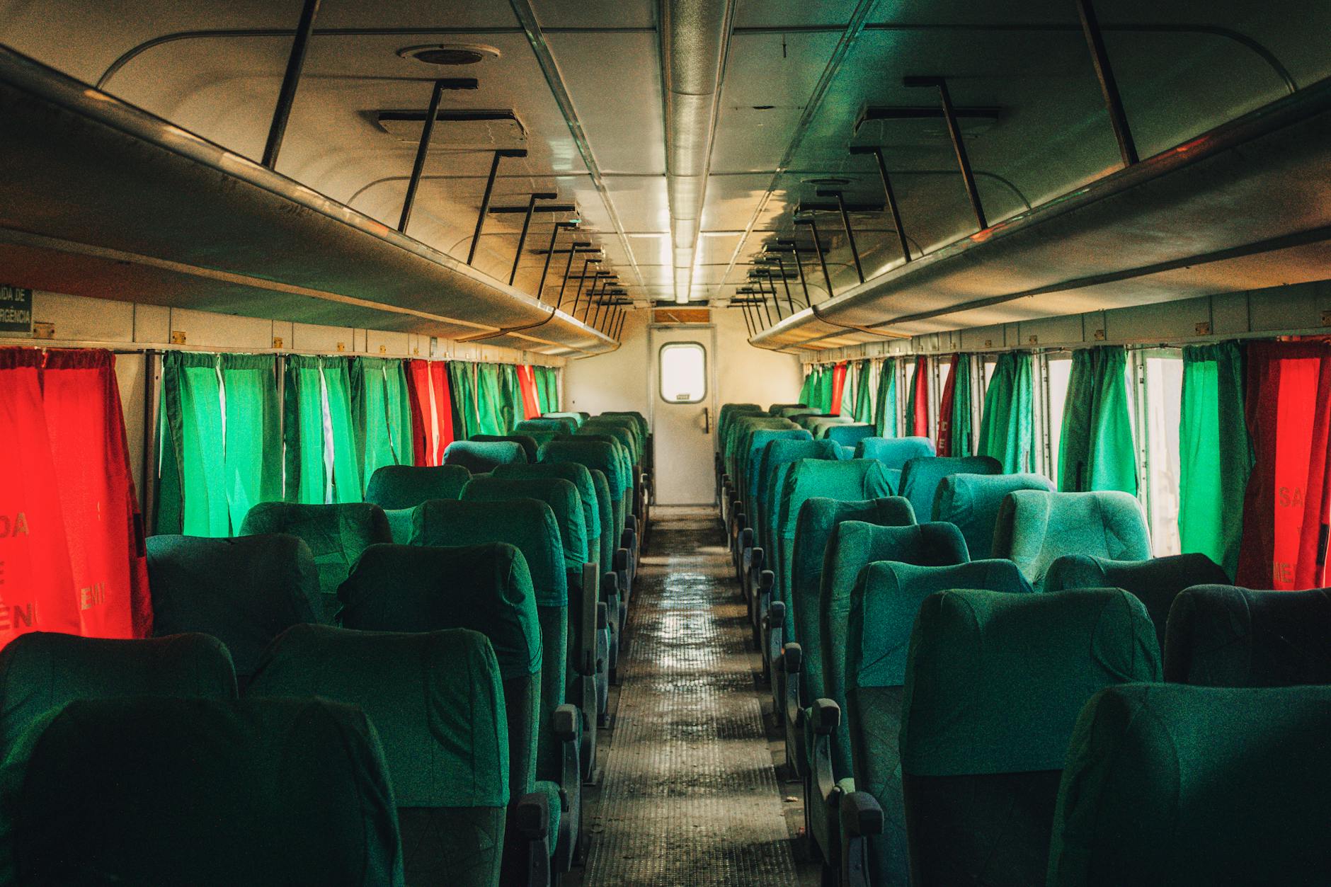 Elegant vintage train car interior with polished wood paneling and panoramic windows