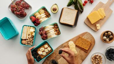 Professional meal prep containers with balanced, healthy meals arranged on a kitchen counter