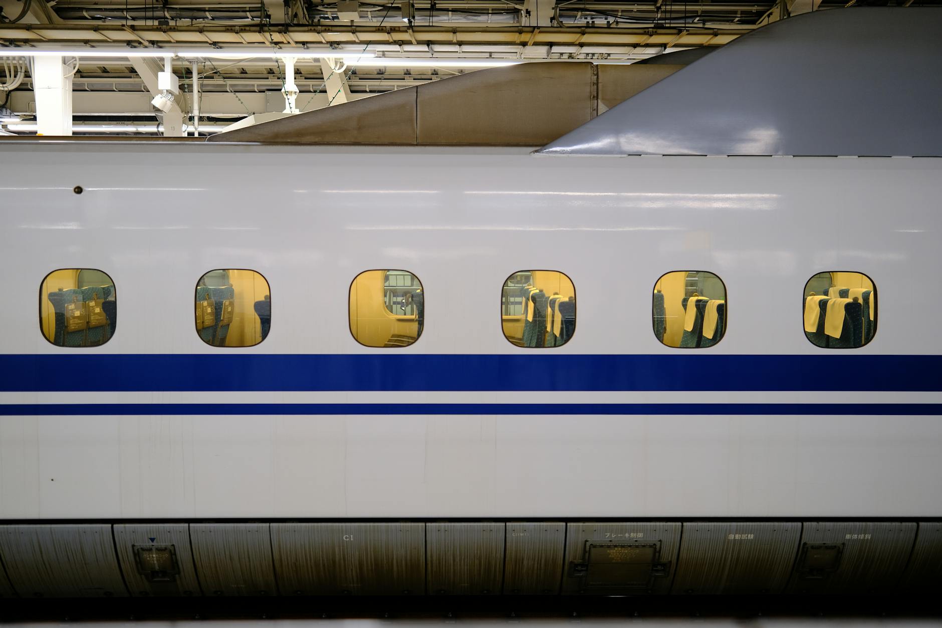 Modern bullet train at station platform showing sleek exterior design