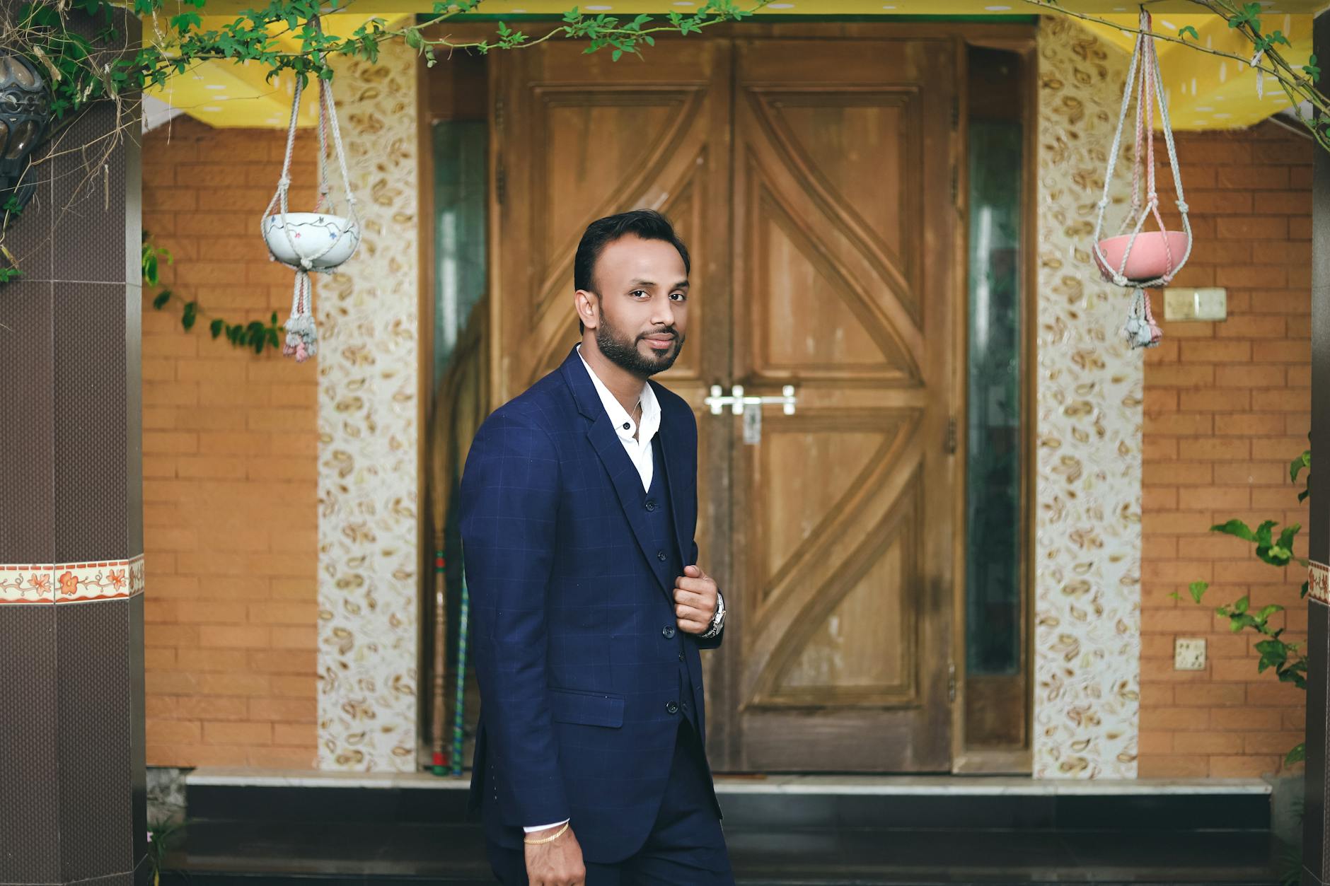 Professional business suit hanging in a closet, representing executive wardrobe selection