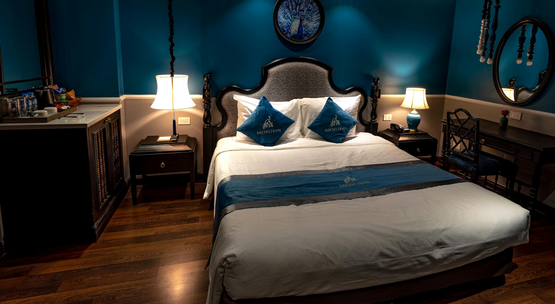 Modern underwater hotel suite with large viewing windows showing marine life swimming past