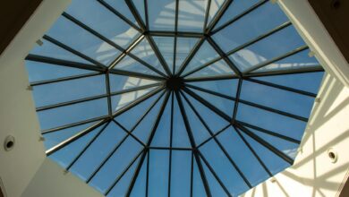 Transparent glass dome structure against snowy mountain landscape