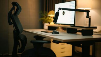 Modern home office with ergonomic desk setup and professional lighting
