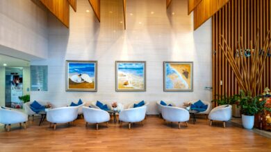 Modern luxury hotel lobby with contemporary design and business travelers