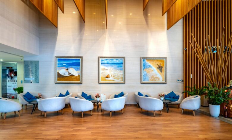 Modern luxury hotel lobby with contemporary design and business travelers