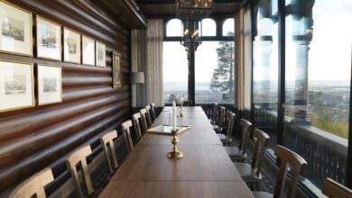 Cozy mountain tea house interior with traditional wooden furniture and warm lighting