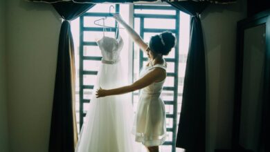 Elegant wedding dress hanging in preparation for destination wedding ceremony