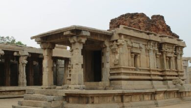Silhouette of ancient temple structure against darkening sky at twilight