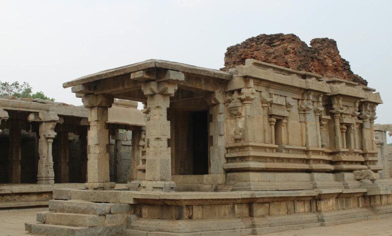 Silhouette of ancient temple structure against darkening sky at twilight