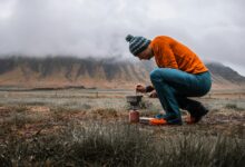 Traditional cooking demonstration in mountain village setting with authentic Berber kitchen utensils