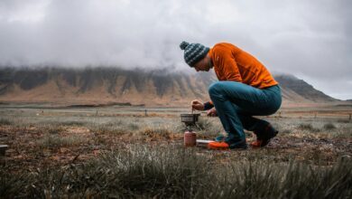Traditional cooking demonstration in mountain village setting with authentic Berber kitchen utensils