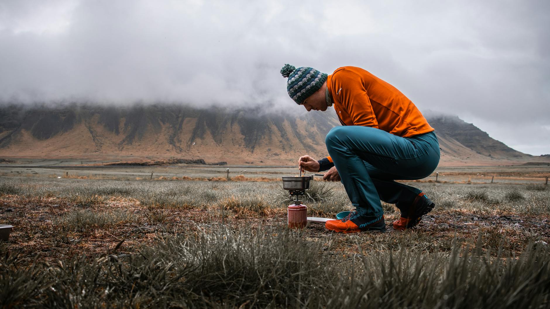 Traditional cooking demonstration in mountain village setting with authentic Berber kitchen utensils