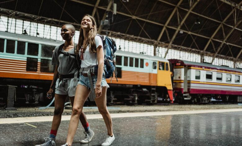 Person working on laptop at tropical beach location representing digital nomad lifestyle