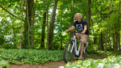 Electric bike on scenic countryside path with rolling hills and green landscape