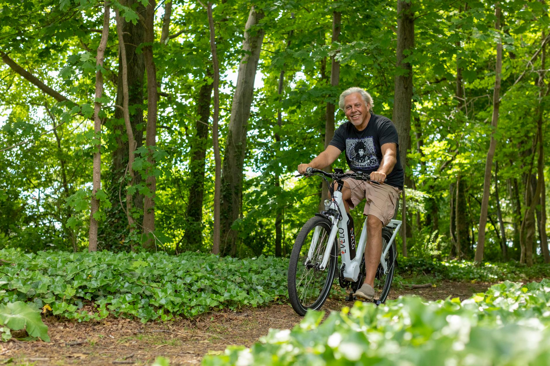 Electric bike on scenic countryside path with rolling hills and green landscape