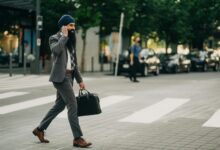 Professional businesspeople having a walking meeting in an outdoor park setting