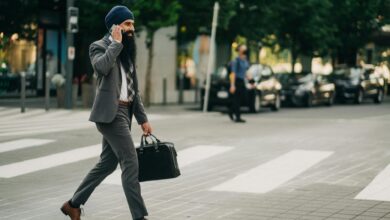 Professional businesspeople having a walking meeting in an outdoor park setting