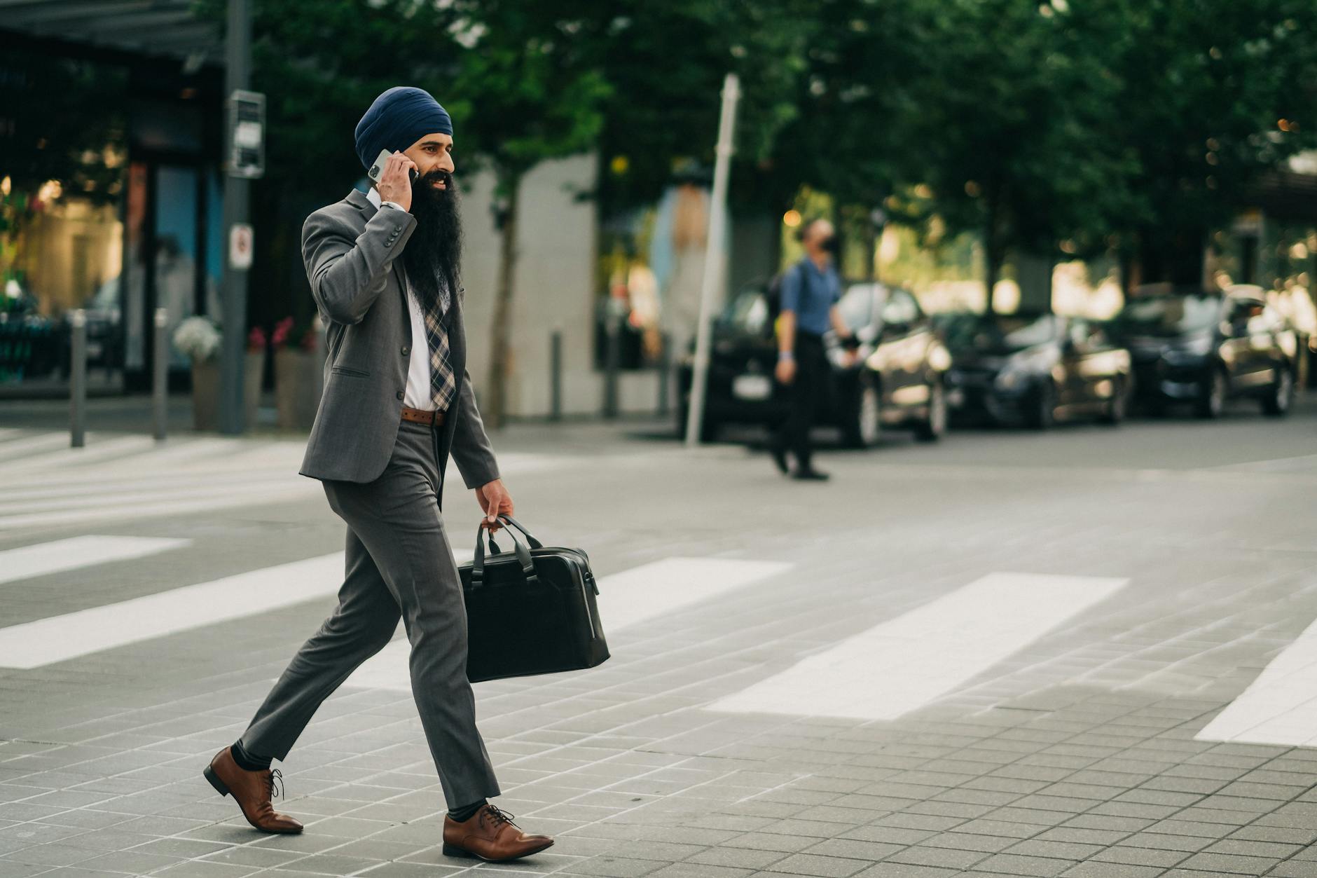 Professional businesspeople having a walking meeting in an outdoor park setting
