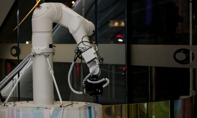 Modern white cylindrical robot in luxury hotel hallway ready for guest room delivery service