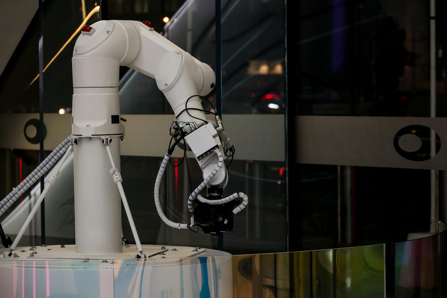 Modern white cylindrical robot in luxury hotel hallway ready for guest room delivery service