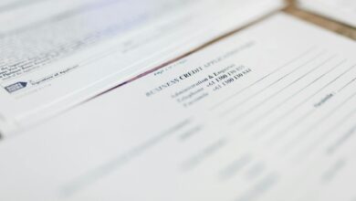 Travel insurance claim forms and documentation spread on desk