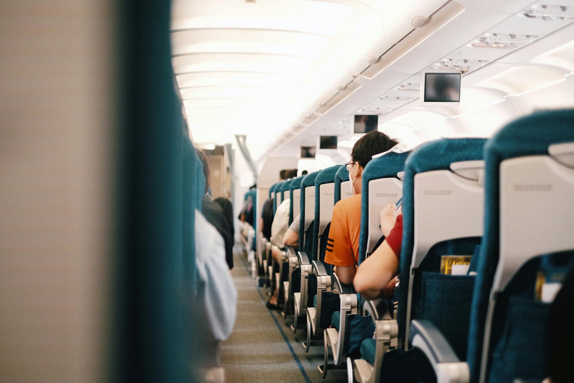 Interior view of commercial airplane cabin with passenger seats