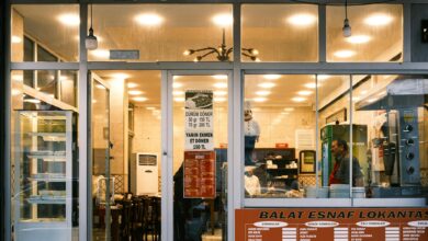 Simple restaurant interior with basic tables and chairs showing authentic local dining atmosphere