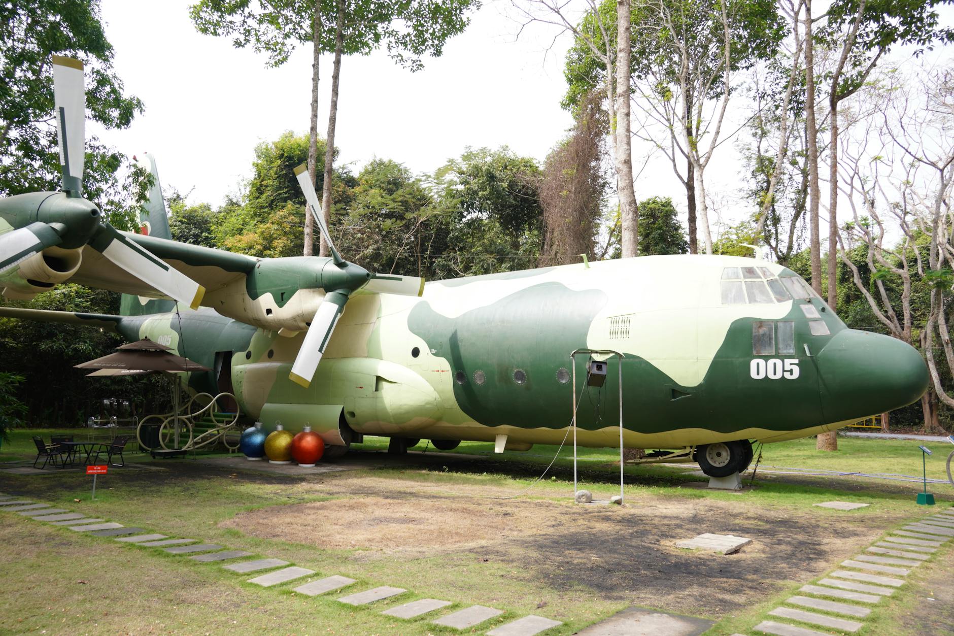 Commercial airplane parked near modern hotel building showing travel industry partnership