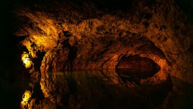 Natural cave interior with geothermal pool and rock formations