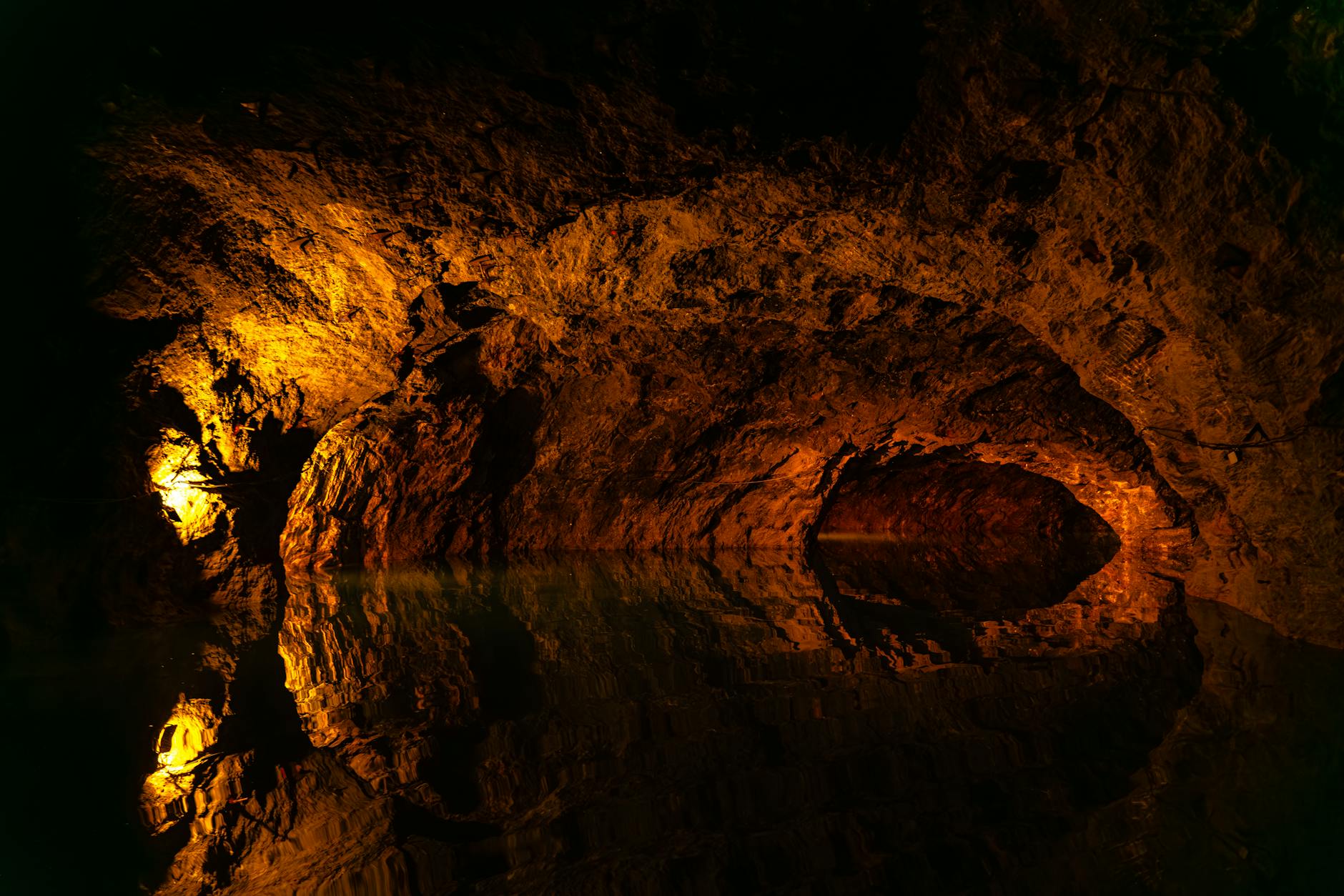 Natural cave interior with geothermal pool and rock formations