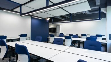 Modern office space with blue accent lighting and contemporary furniture