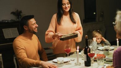 Family gathered around dinner table without phones for quality conversation time