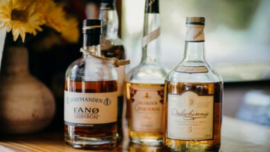 Interior view of traditional Scottish whisky distillery with copper stills and wooden barrels