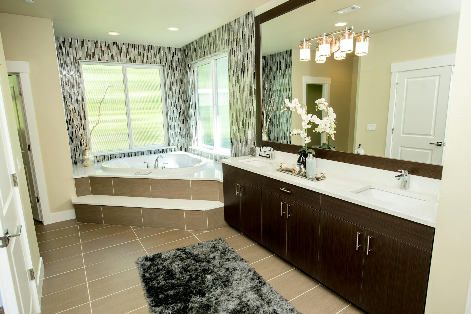 Upscale bathroom interior featuring marble finishes and premium fixtures