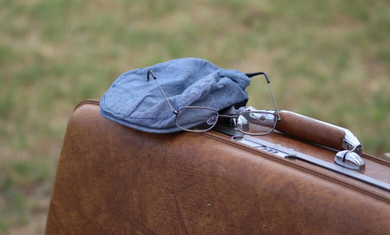 Travel-sized toiletries and electronic accessories arranged for efficient packing