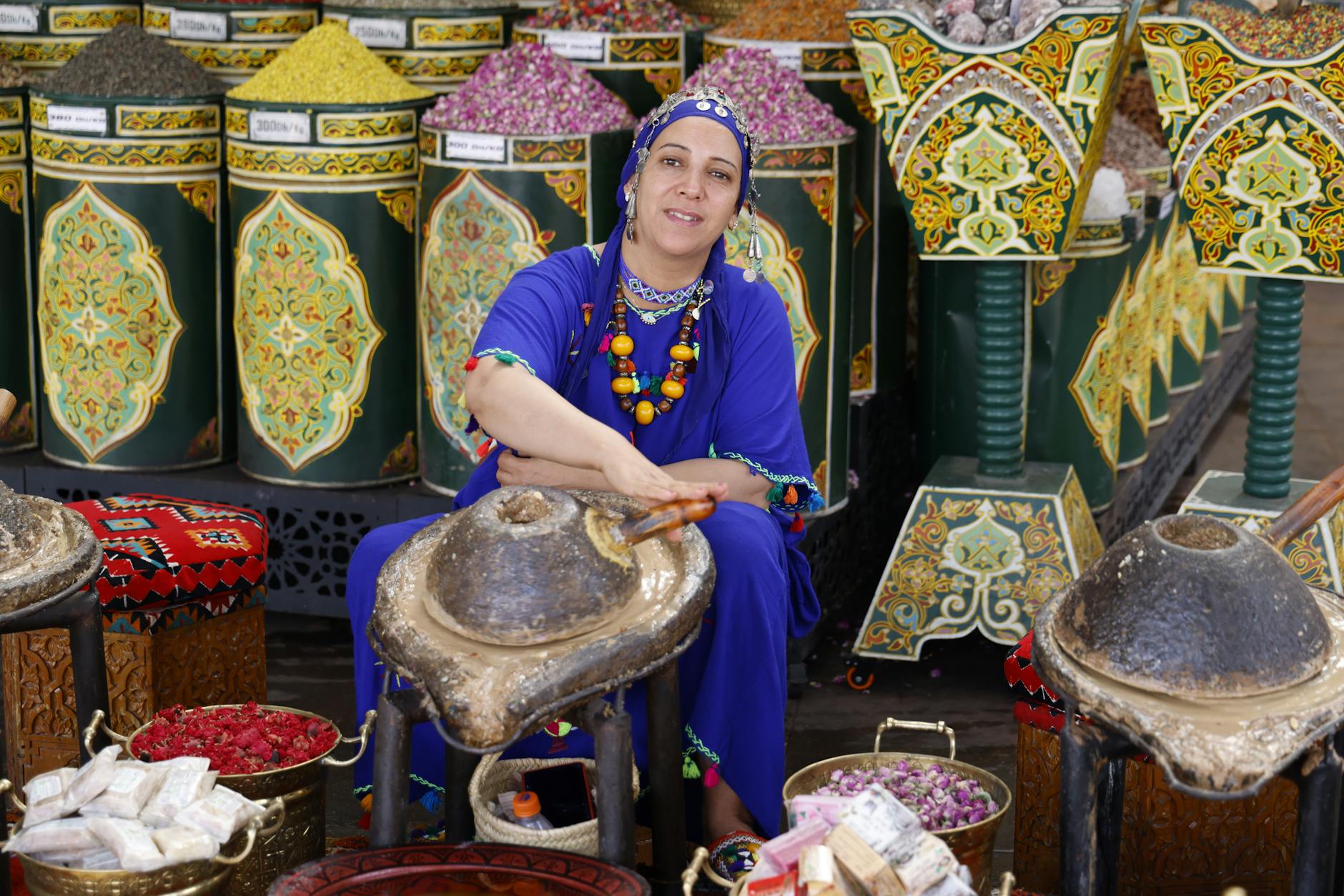 Local woman in traditional clothing working on handwoven textiles using ancestral techniques