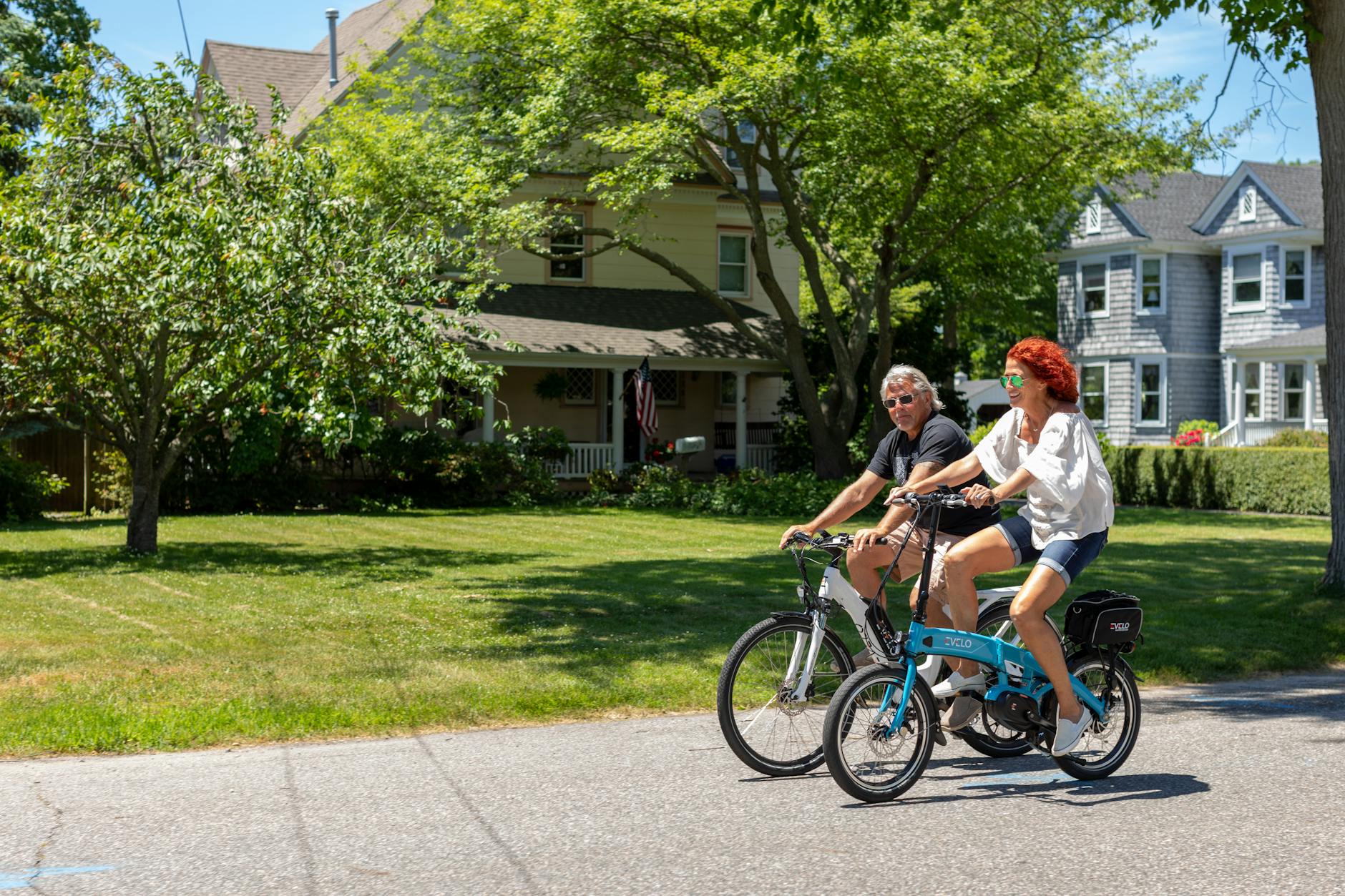Group of tourists on electric bikes exploring historic European city street
