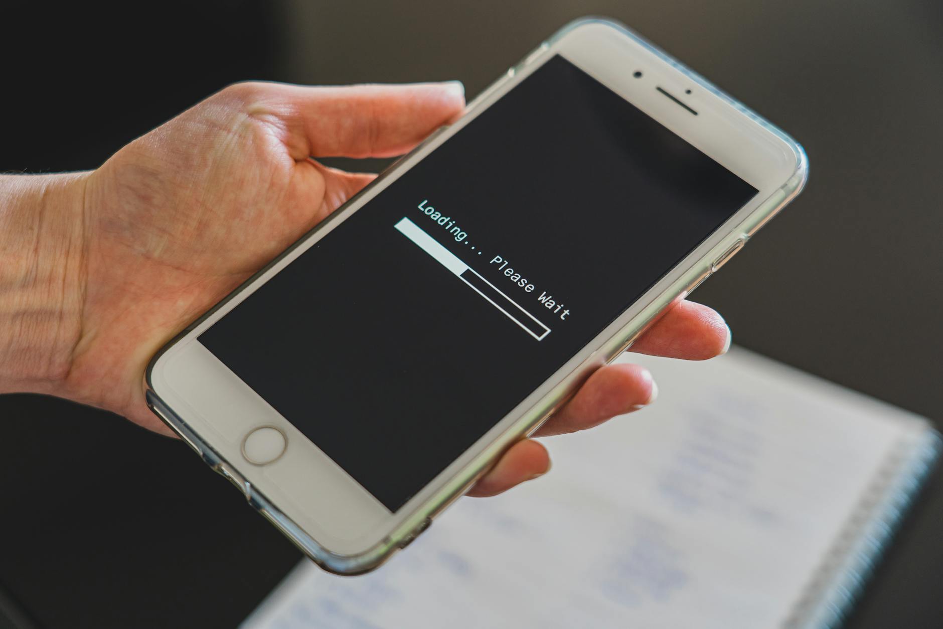 Close-up of smartphone screen displaying cell signal strength bars and network connectivity