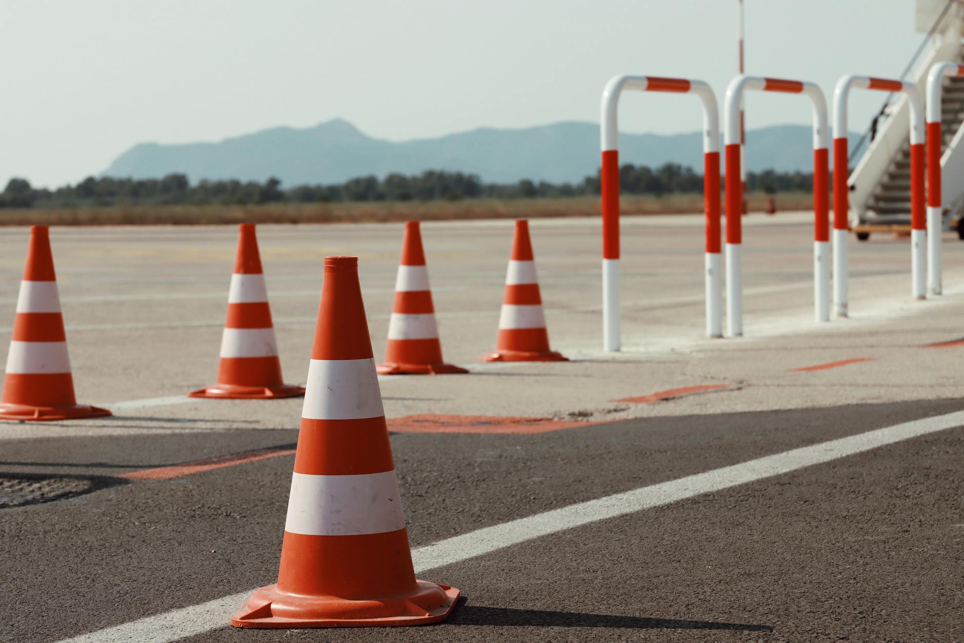 Airport security checkpoint with electronic devices in bins for X-ray screening