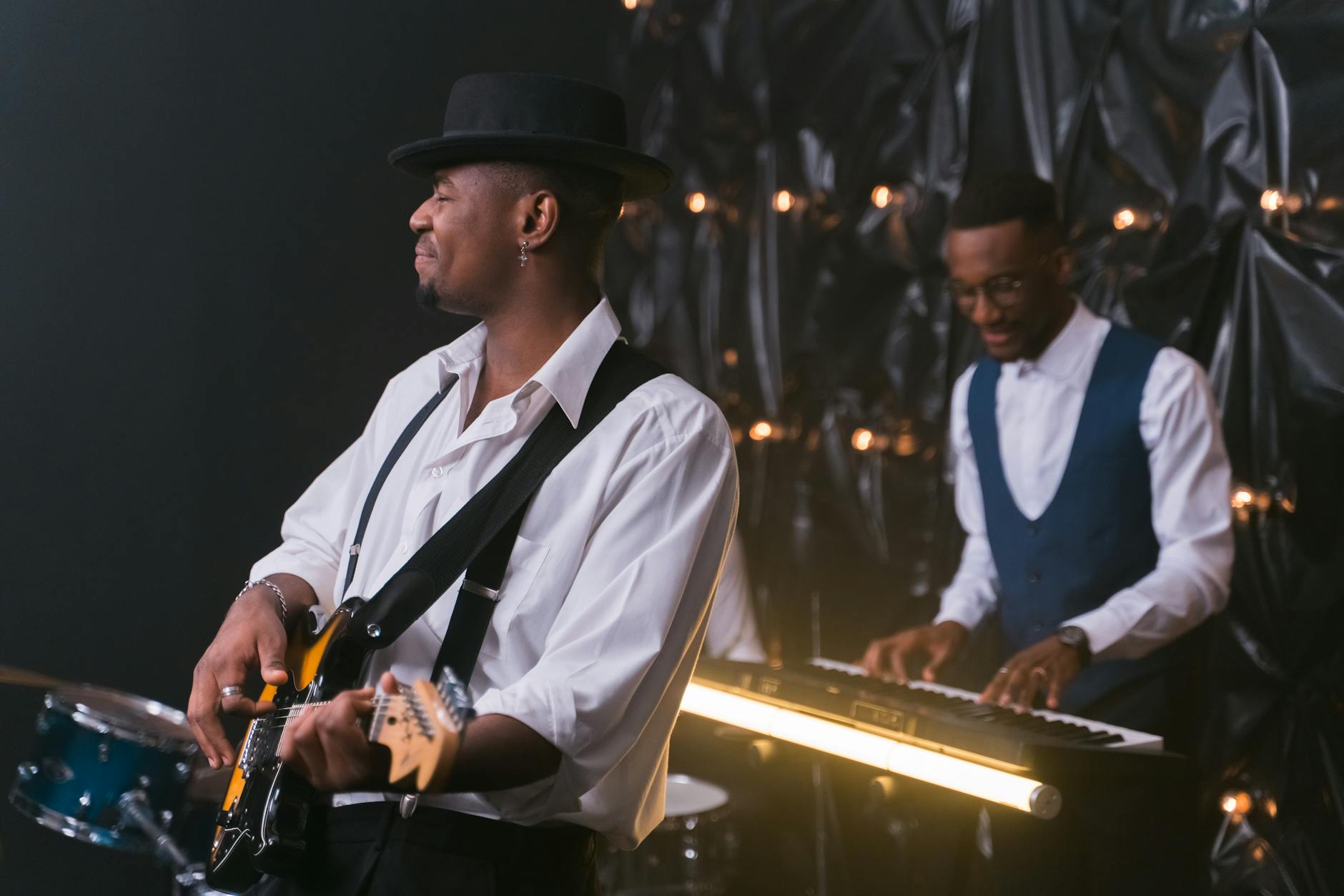 Professional musician performing on stage in an intimate concert setting