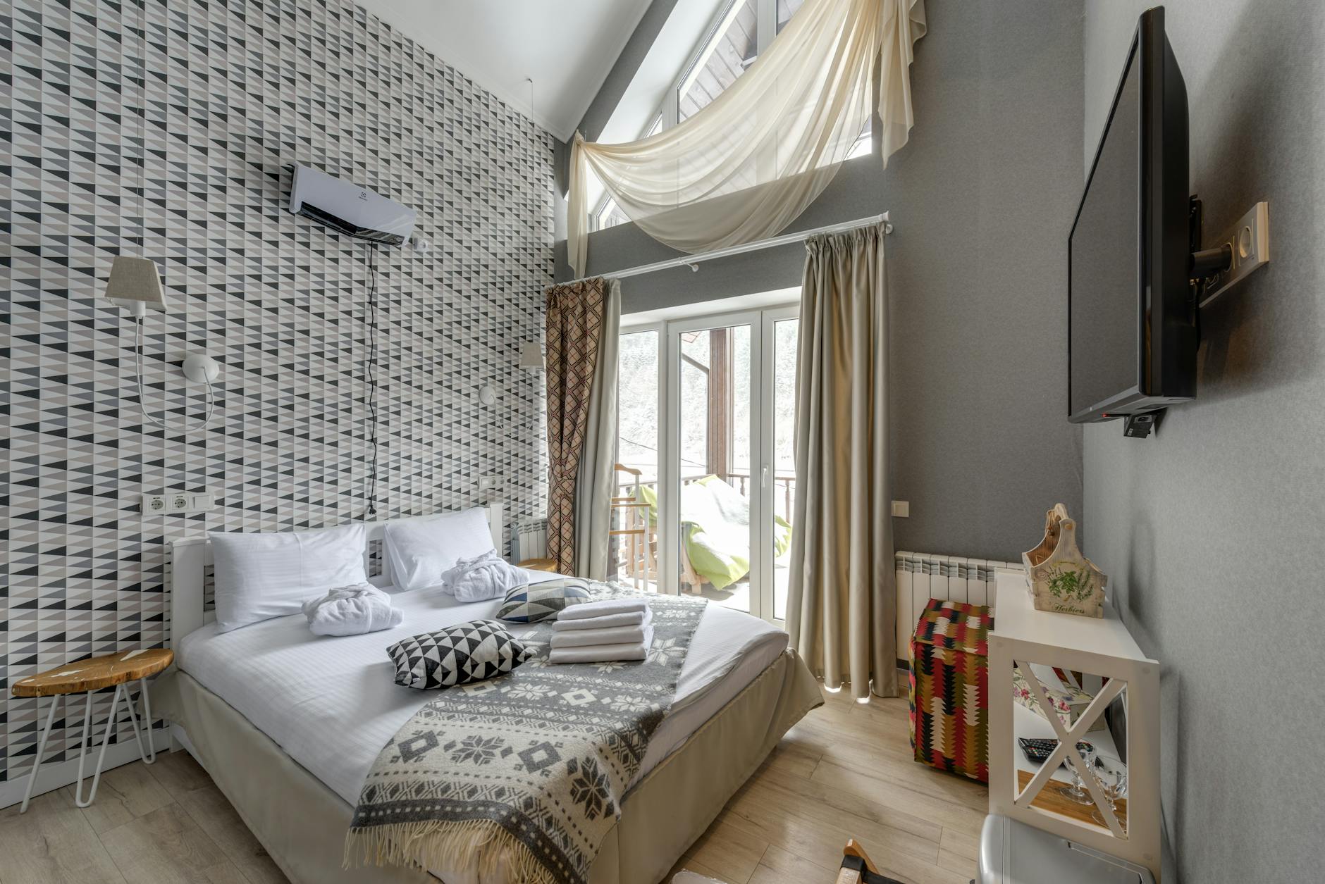 Spacious vacation rental living room with multiple seating areas perfect for group accommodation