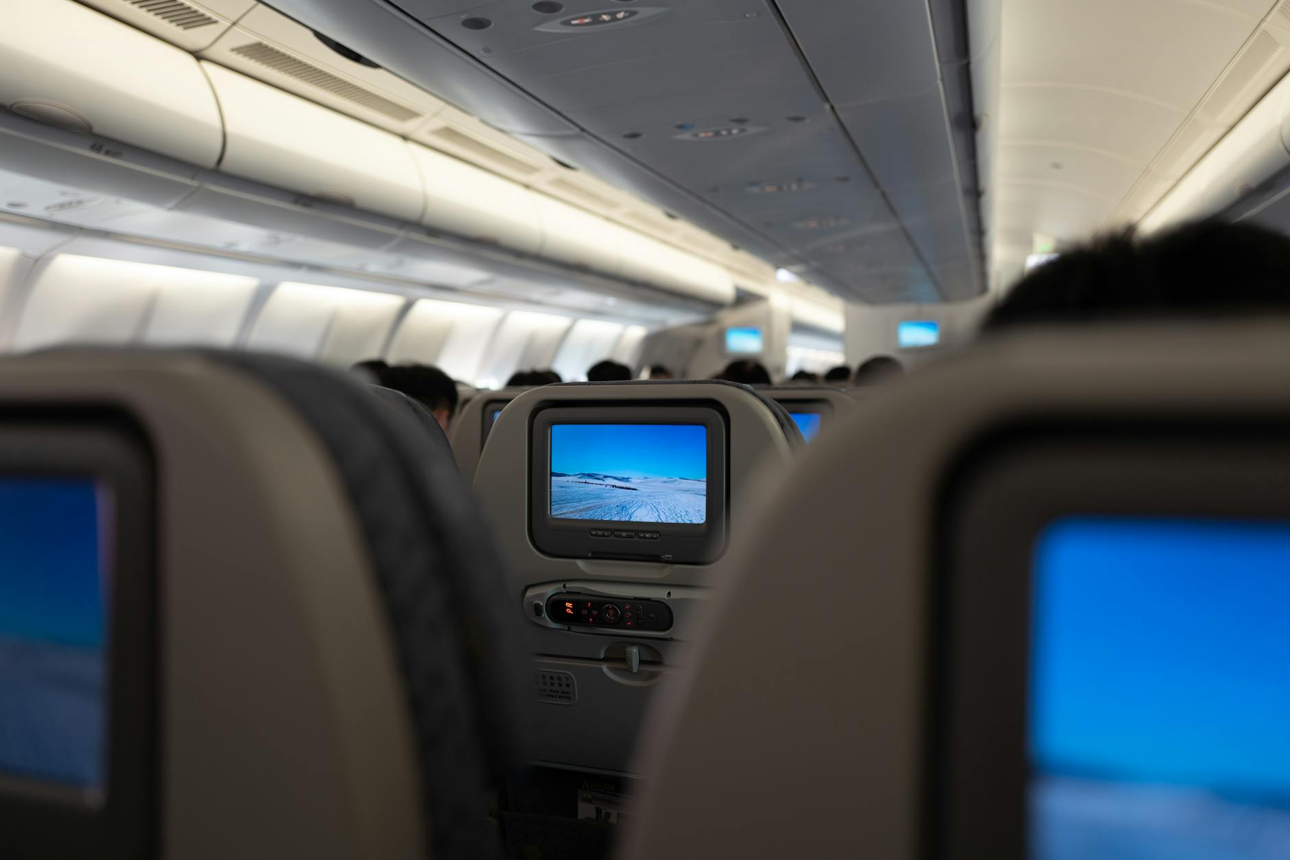 Business class airplane interior with premium seats and service