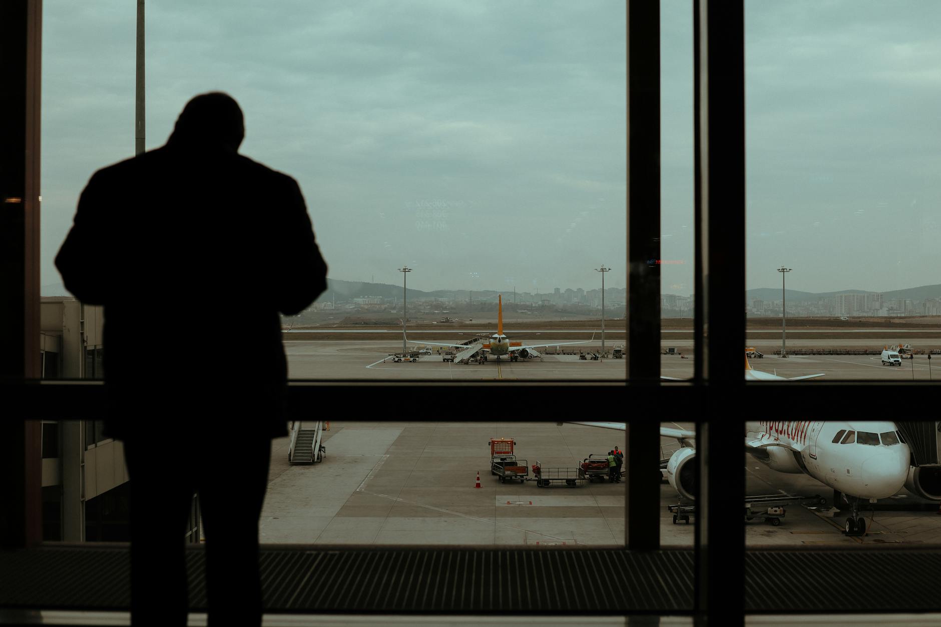 Travelers walking through modern airport departure terminal