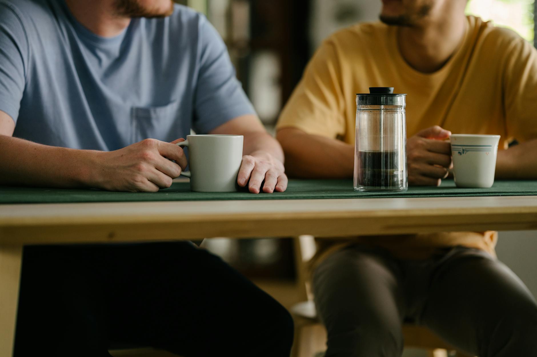 Elegant coffee cup on executive desk with morning light filtering through office windows